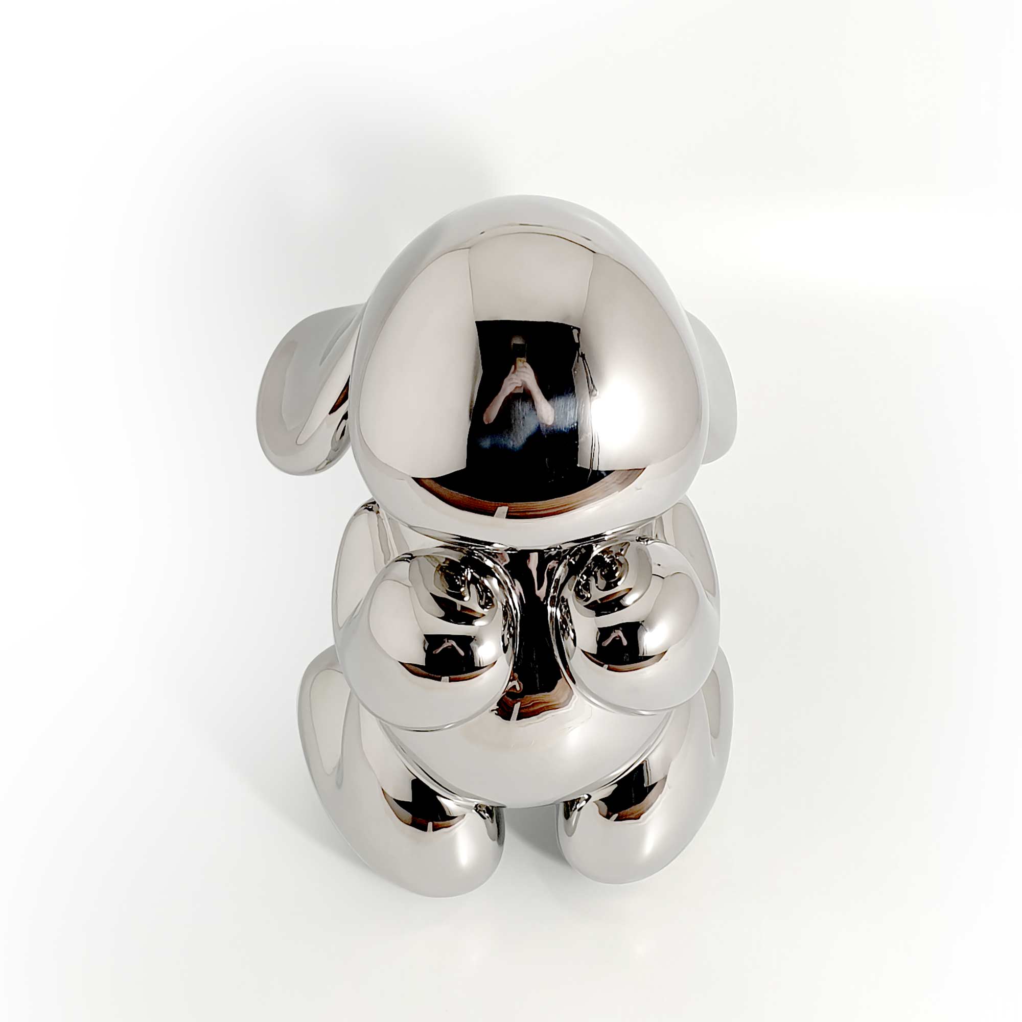 The beggar, dog sculpture, Mirror Polished Stainless Steel Sculpture, by artist Ferdi B Dick, front top view
