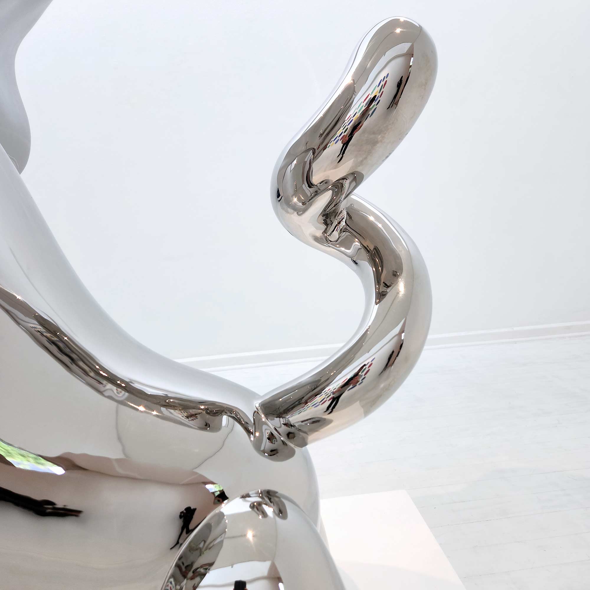 Lions breath polished stainless steel sculpture large size by Ferdi B Dick , tail close-up view