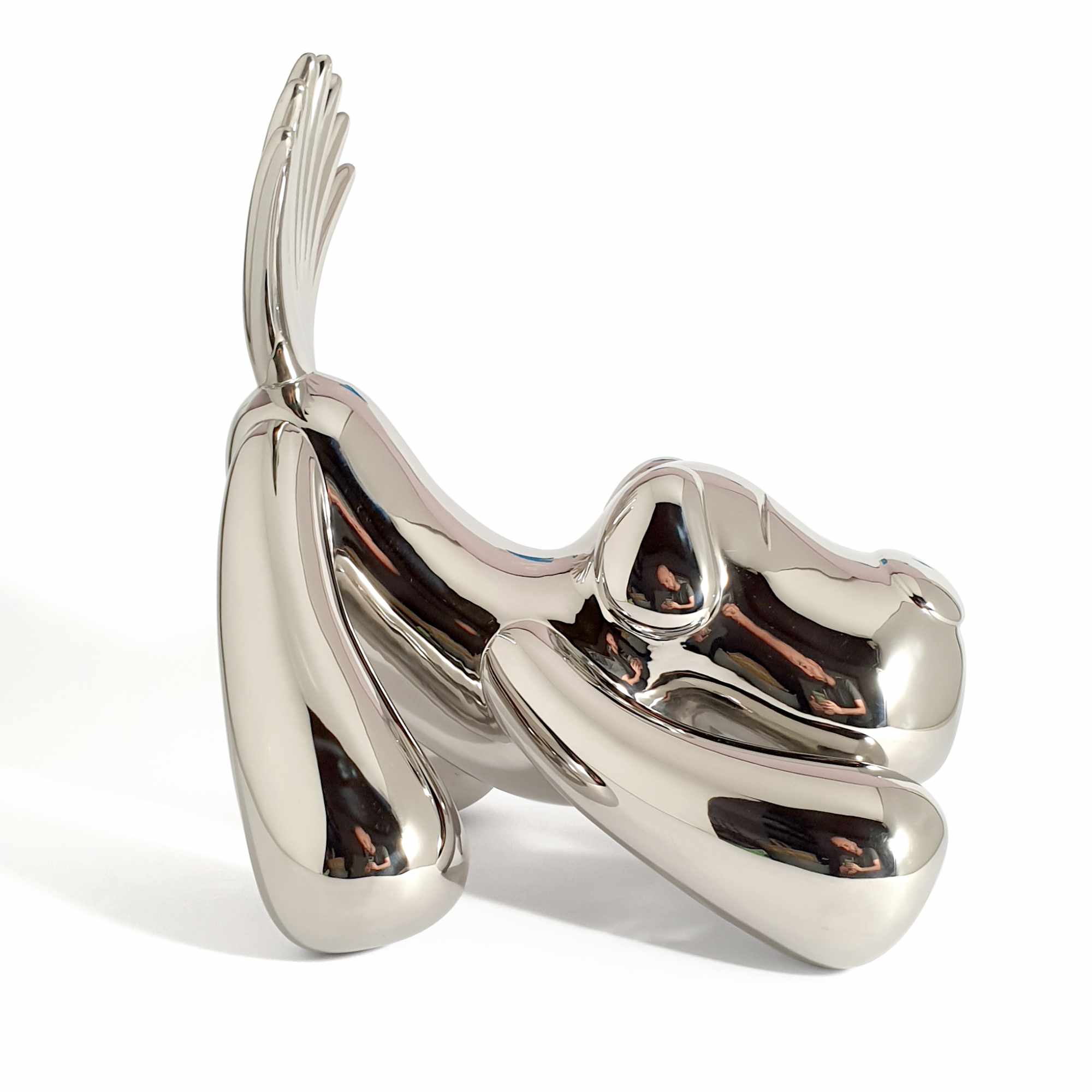 Wagging the dog, dog wagging tail sculpture, Mirror Polished Stainless Steel Sculpture, by artist Ferdi B Dick, side view